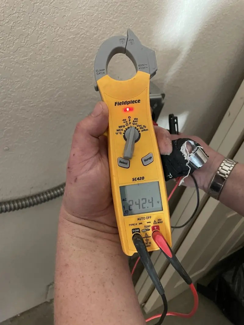 Voltage testing with clamp meter during Outlet Installation in Crawfordsville